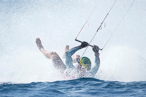 Bruno Lobo of Brazil falls during the men's kite semifinal race